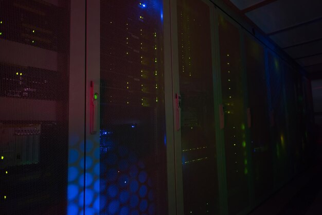 A close-up of a server room with flashing lights, partially obscured by a digital glitch effect. Overlaid on the glitch are fragmented data patterns and security breach symbols, illustrating the challenges in maintaining data security in an AI-driven environment.