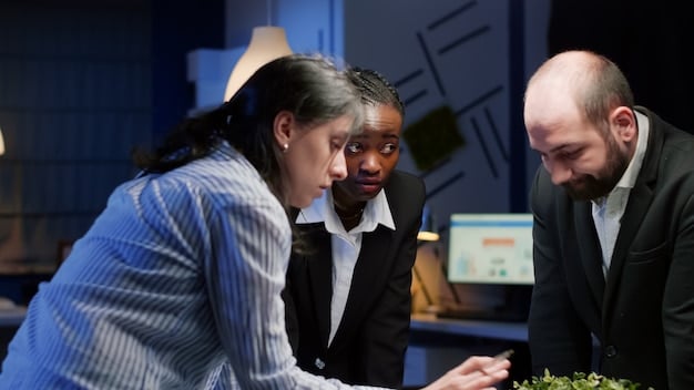 A diverse team of professionals collaborating in a modern office. They are reviewing an AI compliance checklist on a large screen, signifying the importance of teamwork and thoroughness in AI compliance efforts.